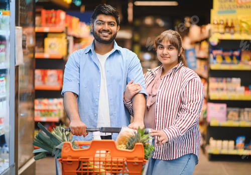 Preview: Indian couple shopping for groceries in supermarket