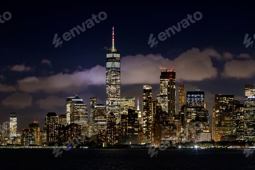 Preview: A vibrant sunset panorama of Manhattan downtown skyline, viewed from the river
