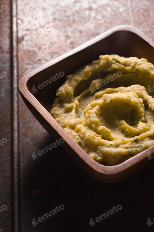 Preview: Puree beans in a wooden bowl on the table square