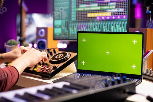 Preview: Sound engineer twisting pre amp knobs on mixing console in home studio