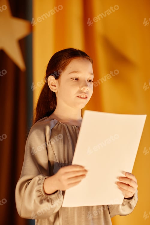 Preview: Young Girl Reading Script on Stage