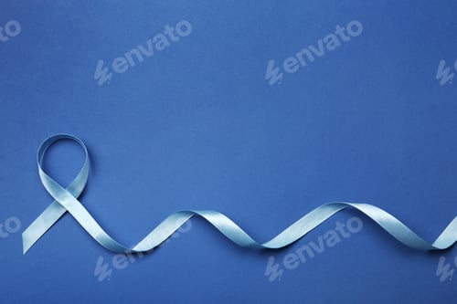 Preview: Blue ribbon on color background, top view with space for text. Colon cancer awareness concept