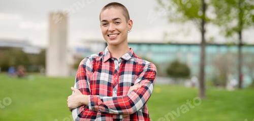 Preview: Portrait of natural millennial woman with short shaved hair,