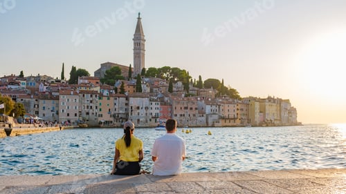 Preview: Relaxing by the calm waters of Rovinj, Croatia as the sun sets over charming coastal architecture