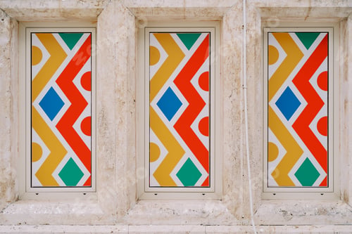 Preview: Colorful mosaic windows on the marble wall of the building