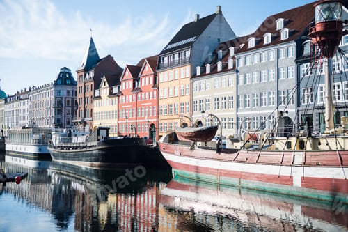 Preview: COPENHAGEN, DENMARK - 06 MAY, 2018: Nyhavn pier with buildings, ships and boats in the Old Town of