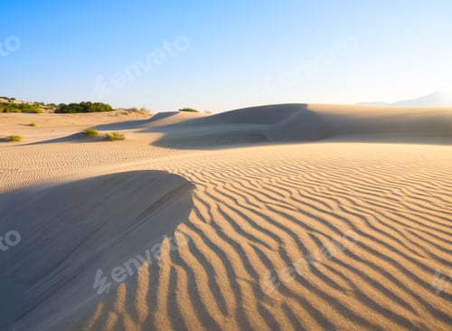 Preview: Sand dunes in the desert. Landscape in the daytime. Lines in the sand. Dunes and sky.