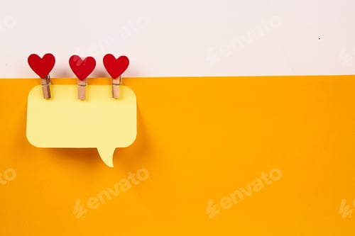 Preview: a note on a yellow piece of paper and a wooden clothespin with a heart Creativity Copy Space