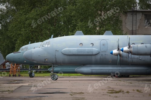 Preview: Closeup of old soviet civil propeller airliner. Russian turboprop old aircraft parking at airport.