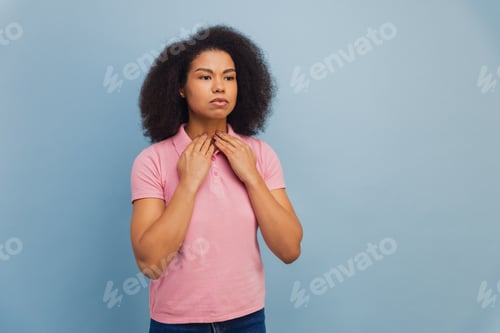 Preview: Young African American woman suffering from throat pain