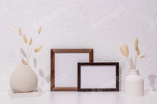 Preview: Home interior with decor elements. Mockup with a frame, dry flowers in a vase. Minimalist style