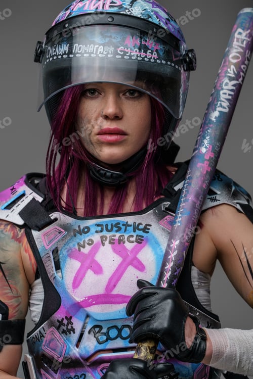 Preview: Portrait of aggressive female protester with baseball bat