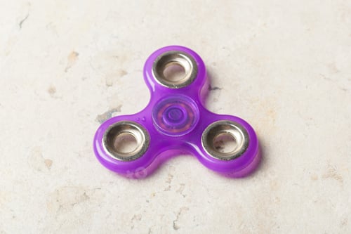 Preview: fidget SPINNER stress relieving toy on stone background