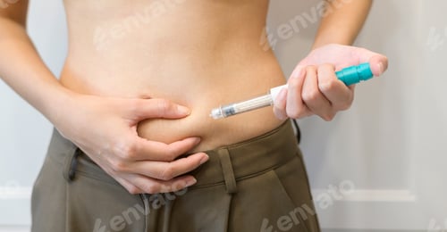 Preview: woman using IVF treatment injection on belly to prepare reproductive fertility