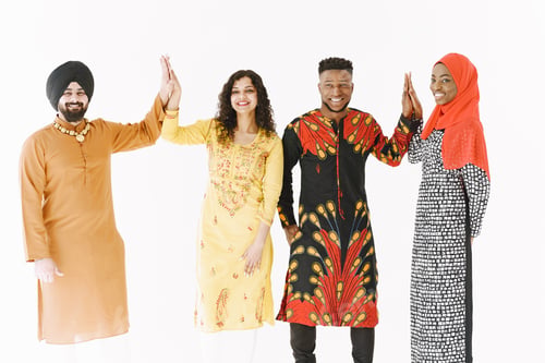 Preview: Group of diverse smiling men wearing in folk costumes