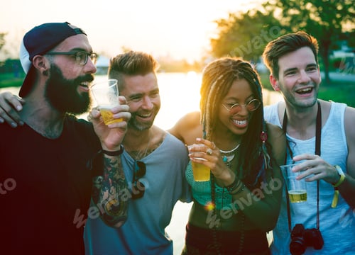 Preview: Group of Friends Drinking Beers Enjoying Music Festival Together
