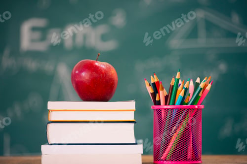 Preview: Pencils and book and blackboard. Education concept.