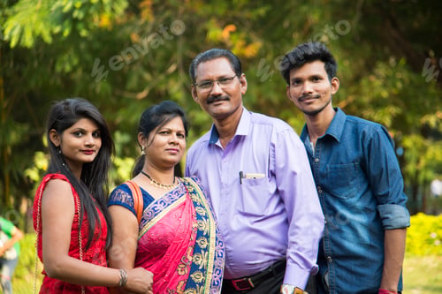 Preview: Happy Indian family at outdoors, Enjoying holiday in park.