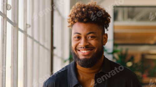 Preview: Portrait Of Young Smiling Businessman Standing In Modern Office