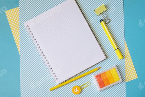 Preview: School supplies. Yellow and blue colors. Empty notebook. Flat lay composition. Space for text.