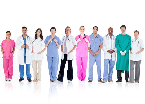 Preview: Happy Team Of Doctors Standing Together In A Line On A White Background