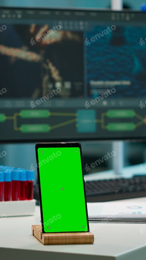 Preview: Smartphone working in laboratory with chroma key display