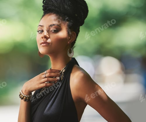 Preview: Gorgeous and she knows it. Portrait of an attractive young woman posing outdoors.