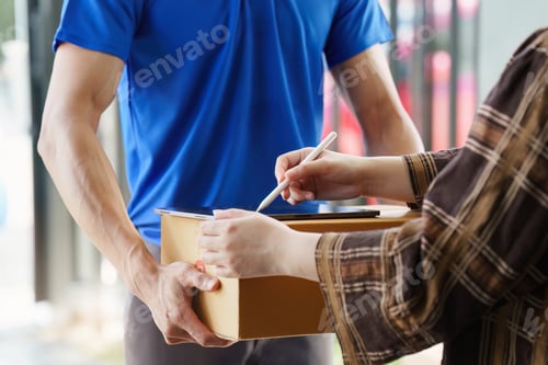 Preview: Asian courier with parcel and delivery logistic concept. Delivery man carrying package while custome