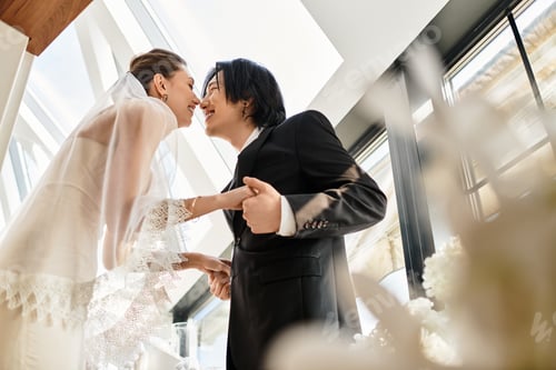 Preview: Celebrating love a beautiful couple shares a tender moment during their wedding ceremony