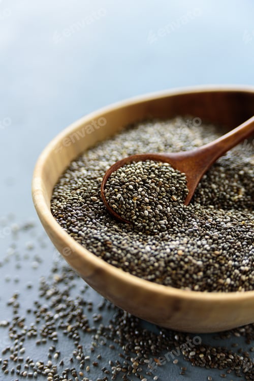 Preview: Chia seeds in old wooden bowl