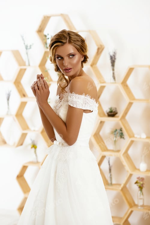 Preview: Woman in Lace Wedding Gown with Unique Background