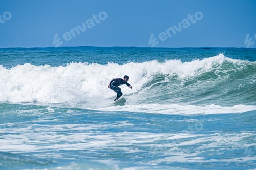 Preview: Surfer riding waves in Furadouro Beach