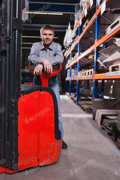Preview: Germany, Neukirch, Foreman leaning on forklift truck, portrait