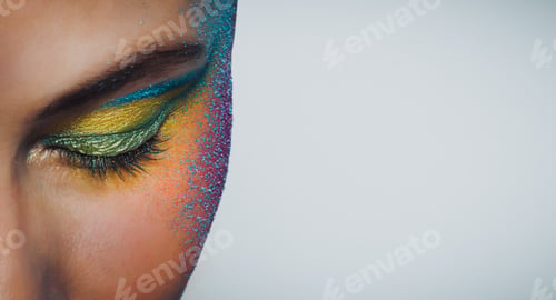 Eye with Bright Colorful Glitter Makeup on Face