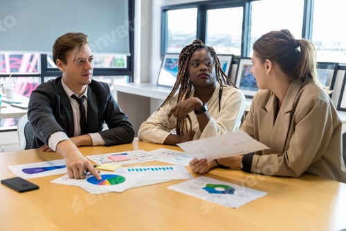 Preview: Diverse colleagues gather in brainstorm discuss statistics together.