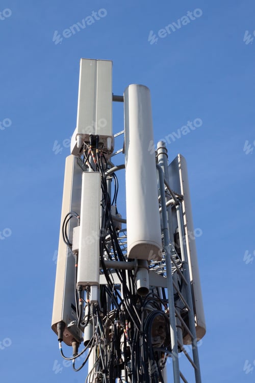 Preview: Vertical shot of an electrical transformer with the clear skies in the background