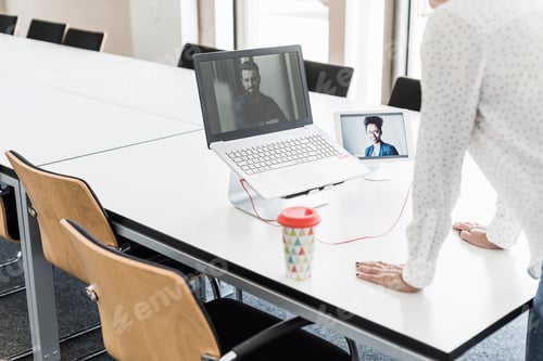 Preview: Businesswoman having a video conference in office