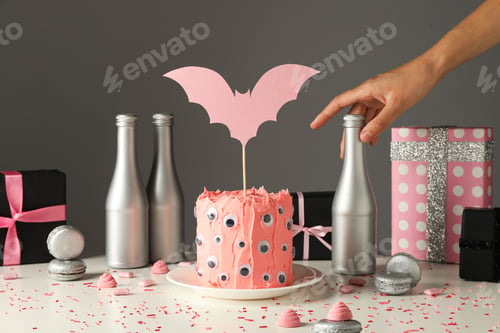 Preview: A festive table with a cake for the Halloween holiday
