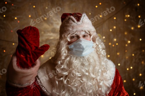 Preview: Santa claus in a medical mask on a wall background with bokeh