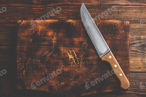 Preview: Knife over wooden cutting board