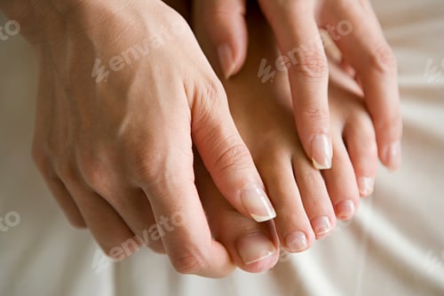 Preview: Hands massaging feet