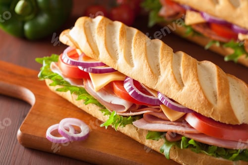 Preview: long baguette sandwich with ham cheese tomato and lettuce