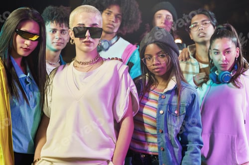 Preview: Group of cool teenager friends with trendy funky style looking to the camera