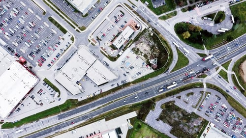 Preview: Aerial view of supermarkets, car parks and roads.