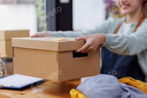 Preview: Startup small business SME. young Asian entrepreneurs using laptop computer check online orders and
