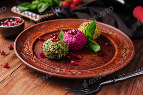 Preview: Colorful vegetarian falafel balls with pomegranate seeds