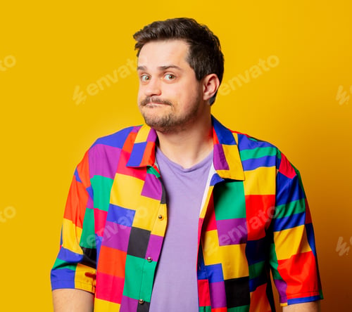 Preview: Surprised funny guy in 90s shirt on yellow background