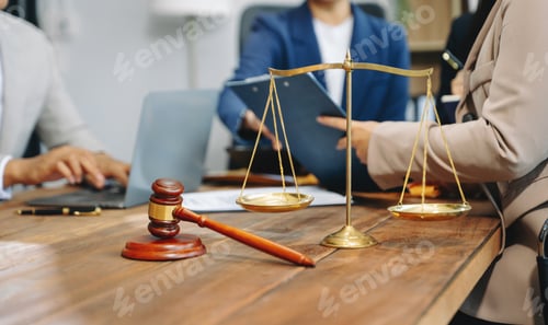 Preview: business people and lawyers discussing contract papers sitting at the table.