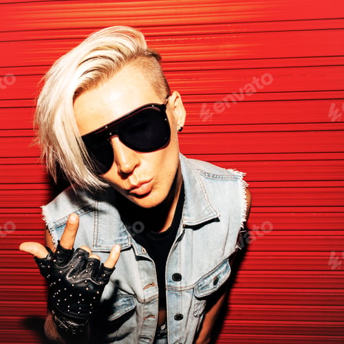 Preview: Girl with short hair in stylish jeans clothes and sunglasses on