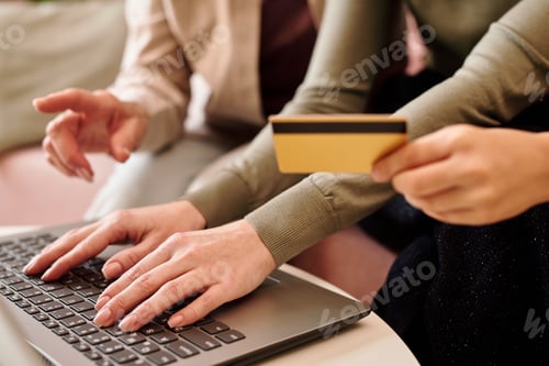 Preview: Hands of three females shopping online